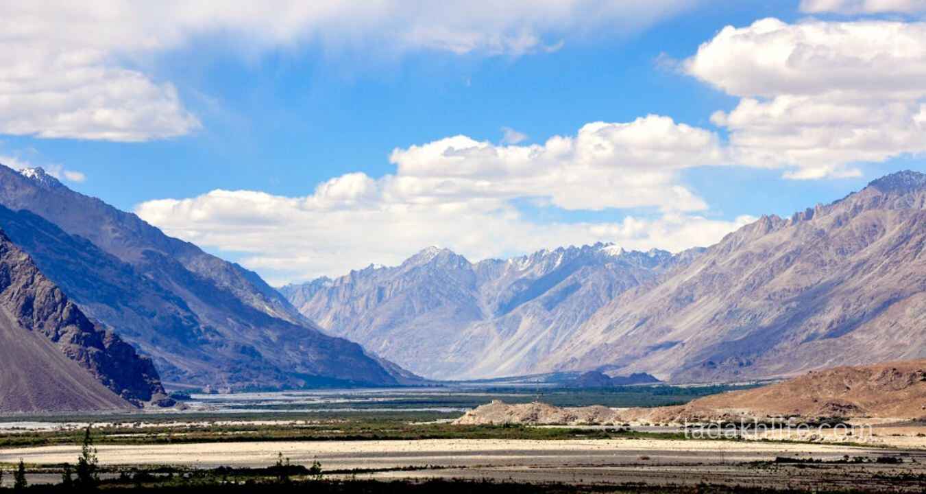 Doda River flowing through Zanskar Valley near Padum with green and rocky mountain scenery